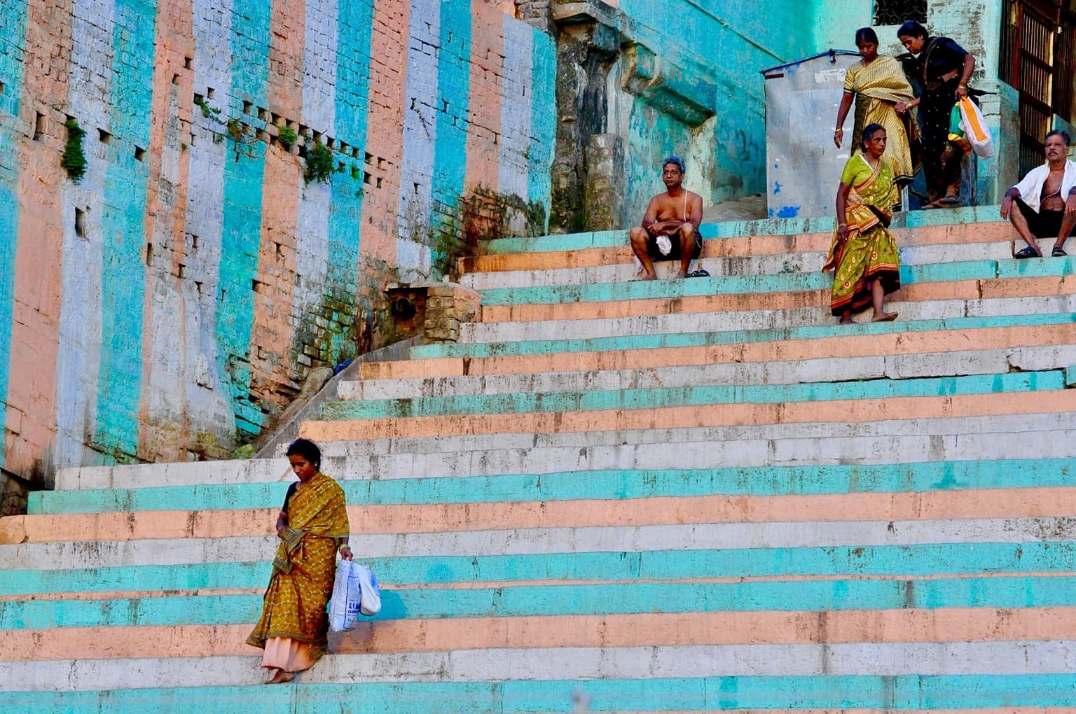 People cross the striped stone steps of Karnataka State Ghat in Varanasi, photographed in 2014